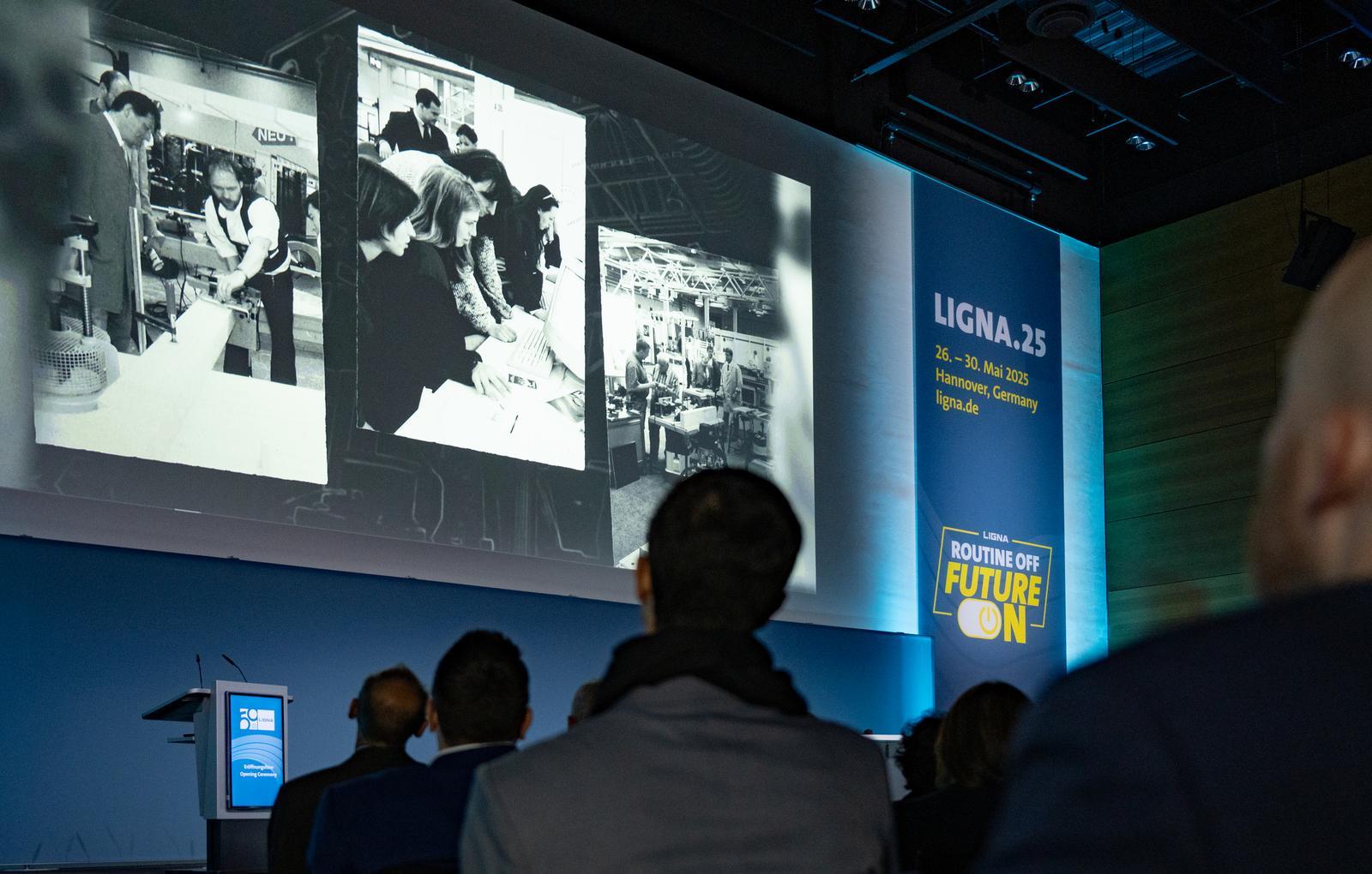 Spectators sit in rows during the opening speech at LIGNA.